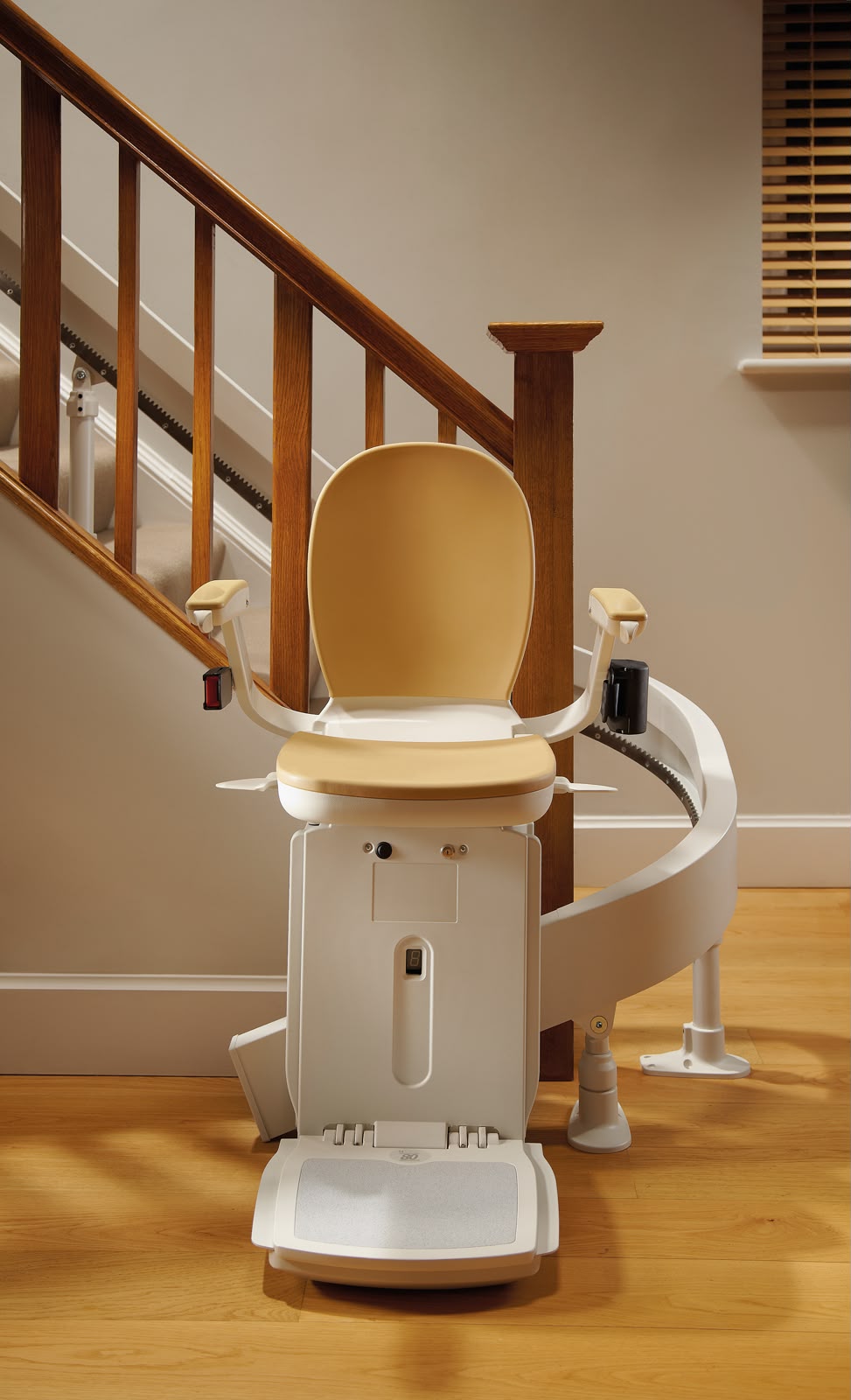 Curved stairlift chair fitted around a wooden banister