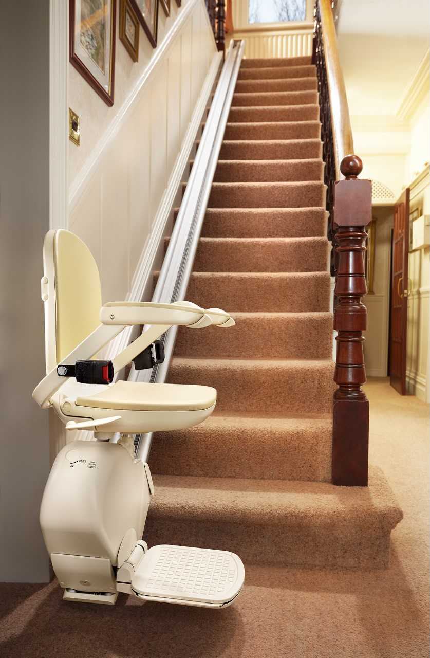 Straight stairlift installed alongside a home staircase